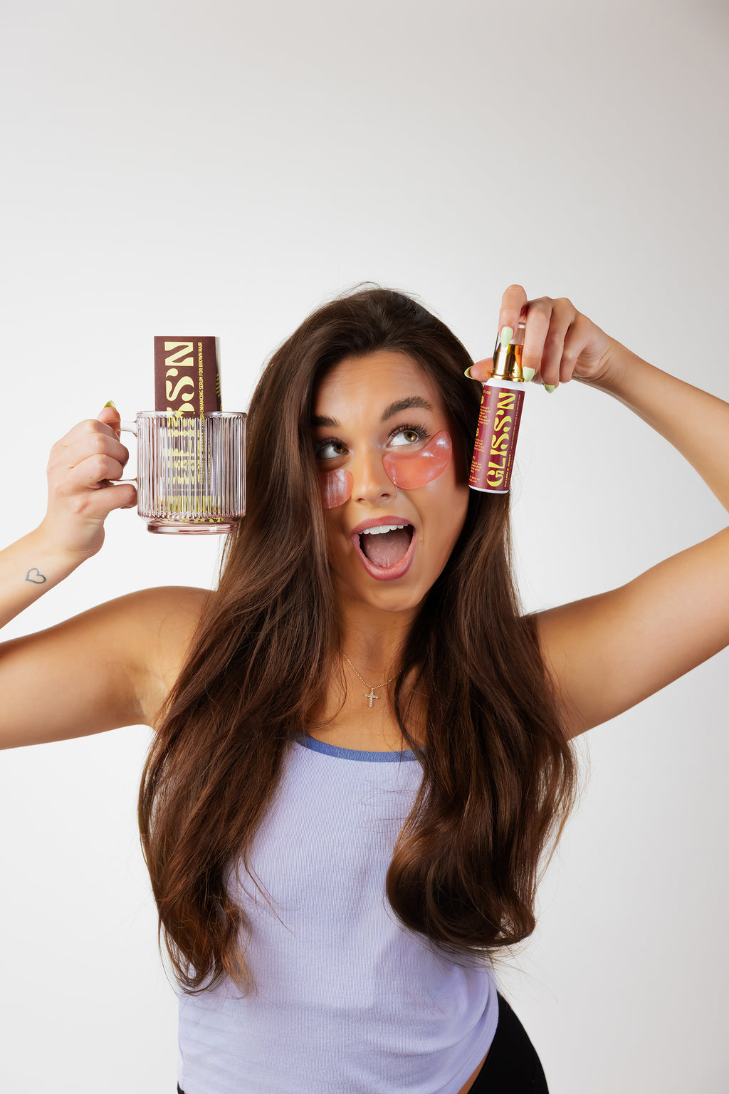 Gliss'n Hair Double Shot hair treatment bottle with pump, featuring sleek black packaging and product label.