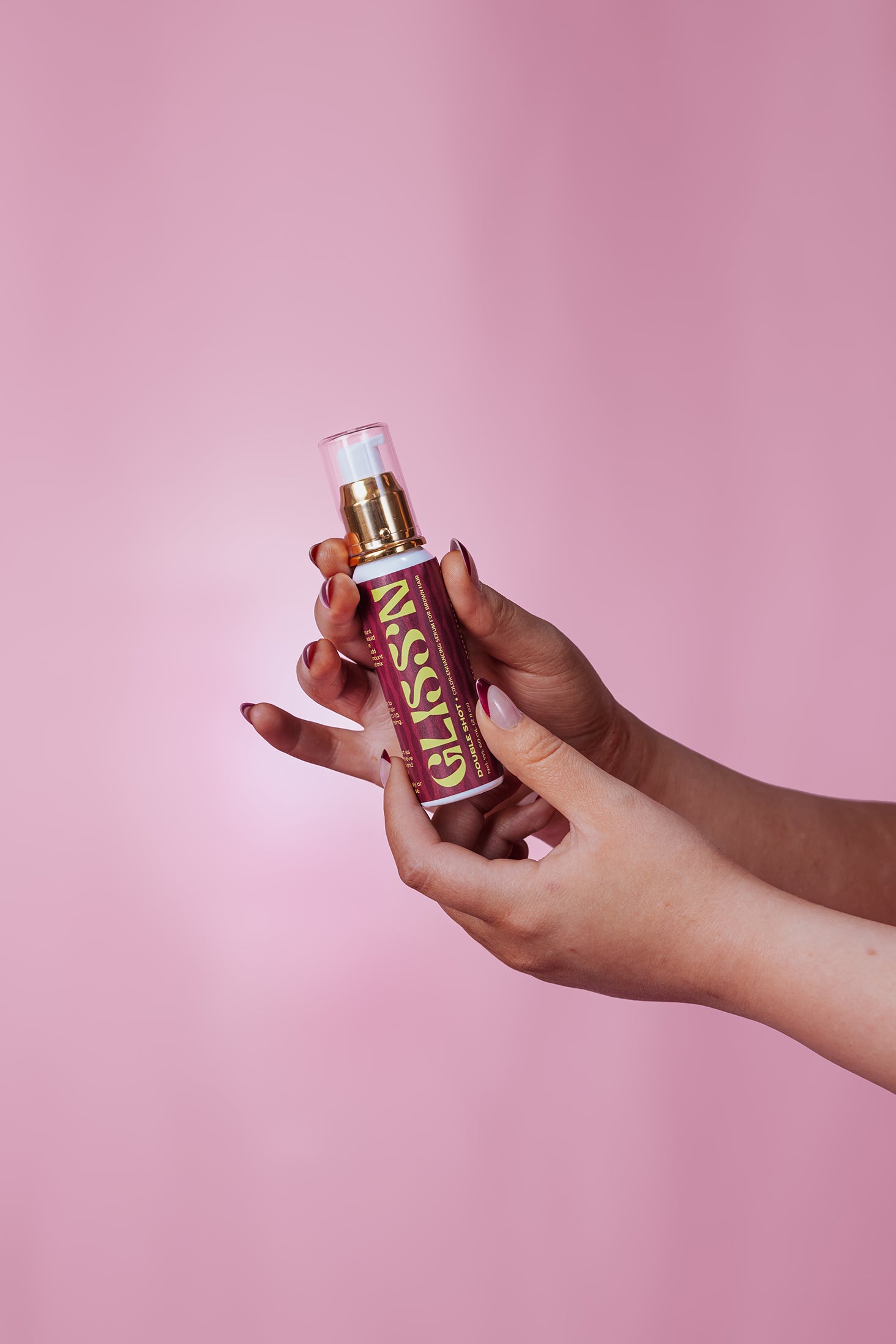 Gliss'n Hair Double Shot hair treatment in a sleek bottle, designed to nourish and strengthen damaged hair.